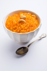 Sabudana or Sago Kesari dessert for Vrat Upvas also known as Sweetened Tapioca Pearl. served in a bowl. selective focus