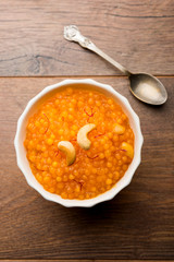 Sabudana or Sago Kesari dessert for Vrat Upvas also known as Sweetened Tapioca Pearl. served in a bowl. selective focus