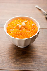 Sabudana or Sago Kesari dessert for Vrat Upvas also known as Sweetened Tapioca Pearl. served in a bowl. selective focus