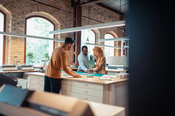 Talented graphic designers working on the project together