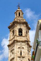 Fototapeta na wymiar The Baroque belfry of the Gothic church of Santa Catalina (Iglesia de Santa Catalina) in Valencia, Spain