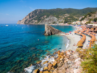 MONTEROSSO AL MARE, ITALY - JULY 28, 2016: Panoramic summer view of the beach in Monterosso, Cinque Terre, Italy.