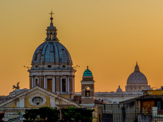 Fototapeta na wymiar Rome, Italy - Amazing summer sunset in Rome with the Vatican in the background. View from the top of the Spanish Steps