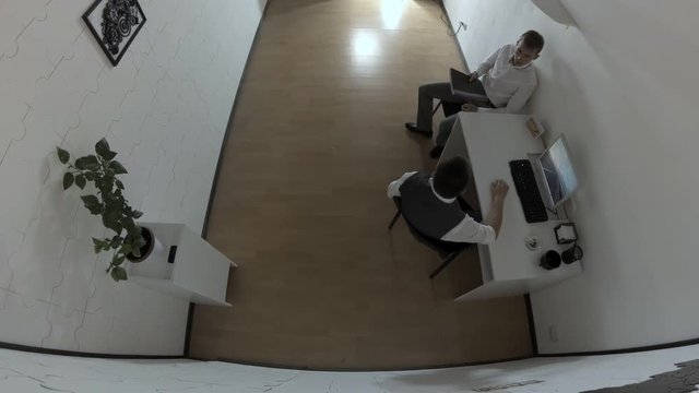 Work in police department. Subordinate worker brought the file with documents to boss. Security camera footage.