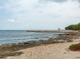 Oceanside Gazebo Sunset Beach with Sand and Rocks.