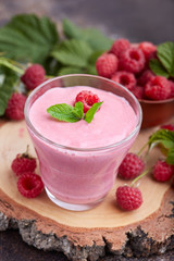 Raspberry smoothie in glass jar. Healthy refreshed homemade beverage.