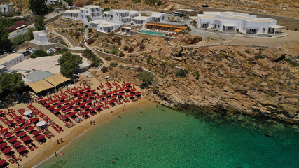 Aerial drone photo of iconic organised beach of Super Paradise with emerald clear sandy seascape, Mykonos island, Cyclades, Greece