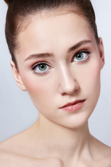 Portrait of young beautiful girl with clean makeup