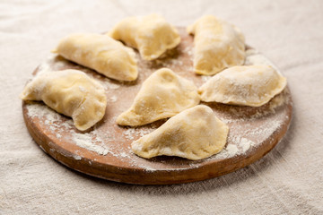 Making dumpling on wood board