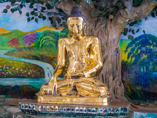 YANGON, MYANMAR - JANUARY 4, 2018: Golden Buddha Statues inside the Shwedagon Pagoda.