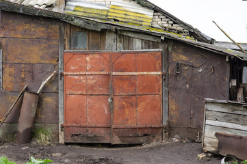 Old garage, shed with rusty gates.