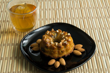 Cake with almonds maple syrup and tea