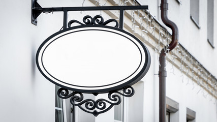 Mock up. Empty round signboard on classical architecture building.