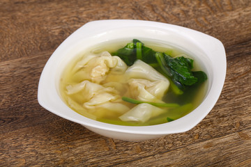Asian traditional Wonton soup with herbs