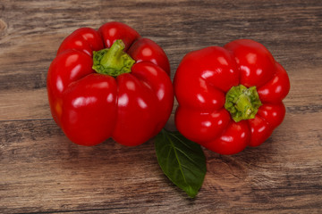 Ripe Red bell pepper over wooden