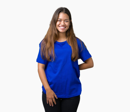 Young beautiful brunette woman wearing blue t-shirt over isolated background with a happy and cool smile on face. Lucky person.