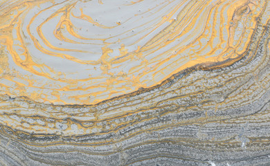 Fototapeta premium photography of abstract marbleized effect background. black, gray, gold and white creative colors. Beautiful paint