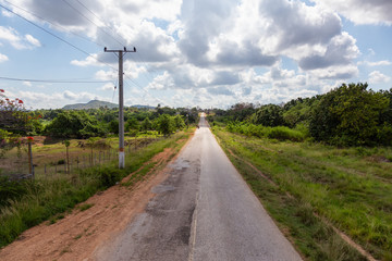 Fototapeta na wymiar Aerial view of a scenic road in a country side near La Boca, Trinidad, Cuba.