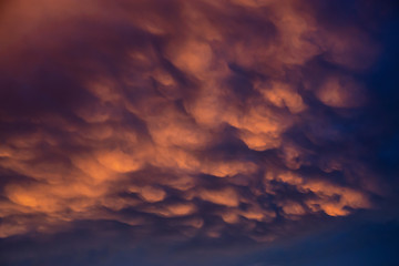 Dramatic Panoramic View of a cloudscape during a dark and colorful sunset. Taken over Beach Ancon in Trinidad, Cuba.