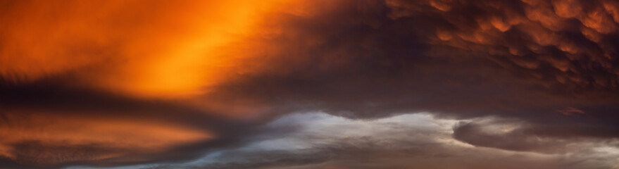 Fototapeta premium Dramatic Panoramic View of a cloudscape during a dark and colorful sunset. Taken over Beach Ancon in Trinidad, Cuba.