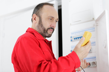 electrician technician at work on a residential electrical panel