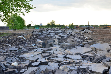 Broken pieces of asphalt, broken road,  repair work at a construction site