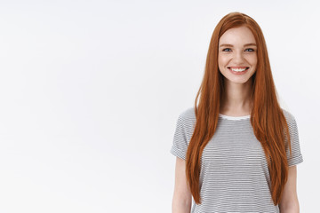 Charming friendly pleasant redhead girl university student smiling happily camera look energized participate dance class learning new hobby standing white background entertained, lifestyle concept