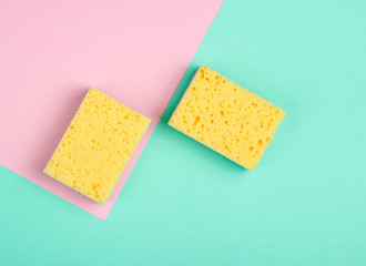 Cleaning minimalism concept. Sponges on a pastel background. Top view