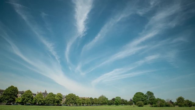 Cloudscape time lapse over green grass and trees of Clifton Down, Bristol UK