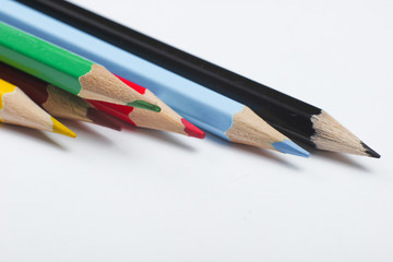 Set of colored pencils on a white background close-up