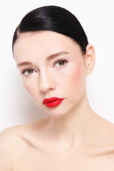 Obraz premium Portrait of young beautiful woman with red lipstick
