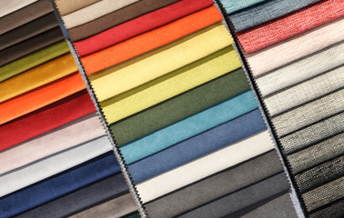 Multi-colored samples of upholstery fabric for sofas and chairs close-up.