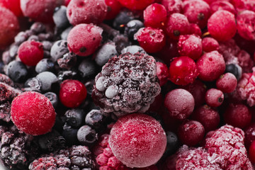 Frozen berries closeup. Cherries, currants, blueberries, blackberries