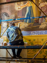CHELYABINSK, RUSSIA - JUNE 5, 2018: Man working at the restoration of frescoes in the St. Simeon...