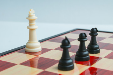  The black pawn comes on the white king. Game of chess. Chess board