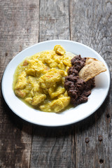 Mexican scrambled eggs in green sauce also called 