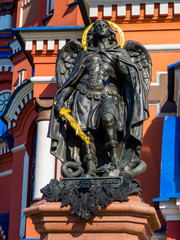 Fototapeta na wymiar IRKUTSK, RUSSIA - JUNE 16, 2018: Angel statue in front of the Church of Our Lady of Kazan.