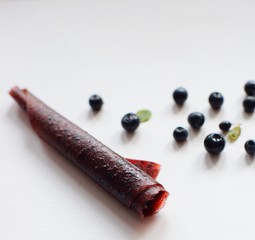 Blueberries are cut into pieces on a gray background