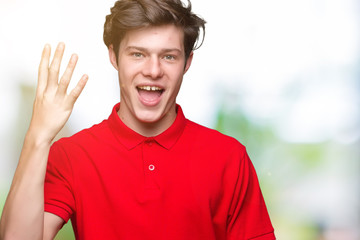 Naklejka premium Young handsome man wearing red t-shirt over isolated background showing and pointing up with fingers number four while smiling confident and happy.