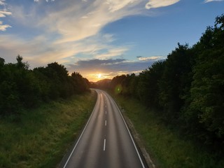 Fototapeta na wymiar driving on highway at sunset