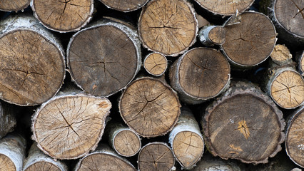 logs. firewood. wood for fireplace. stack of wood for winter. woodpile close up.  firewood surface...