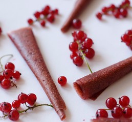 Redberry slices on a white background