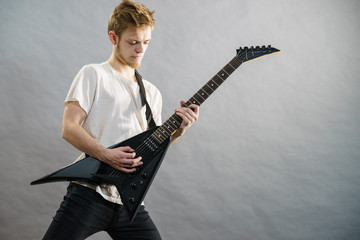 Man playing on electric guitar