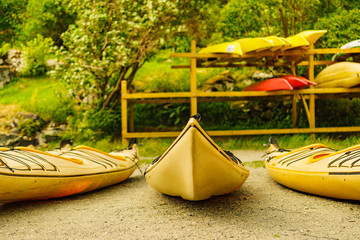 Kayaks on water shore. Rental area