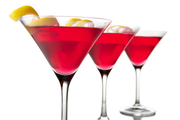 Closeup three cosmopolitan cocktails isolated on white