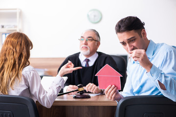 Young couple in the courthouse in divorce concept  