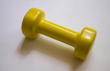 Dumbbells of yellow color for sports.