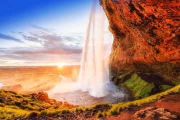 Seljalandsfoss Waterfall,  Iceland. Iconic landmark and travel destination in Iceland. Breathtaking...