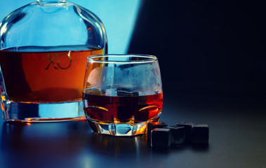 Reusable ice cubes with glass of malt whisky