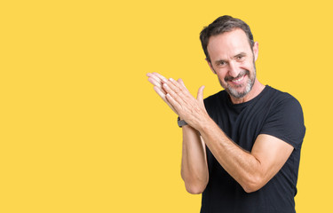 Handsome middle age hoary senior man over isolated background Clapping and applauding happy and joyful, smiling proud hands together
